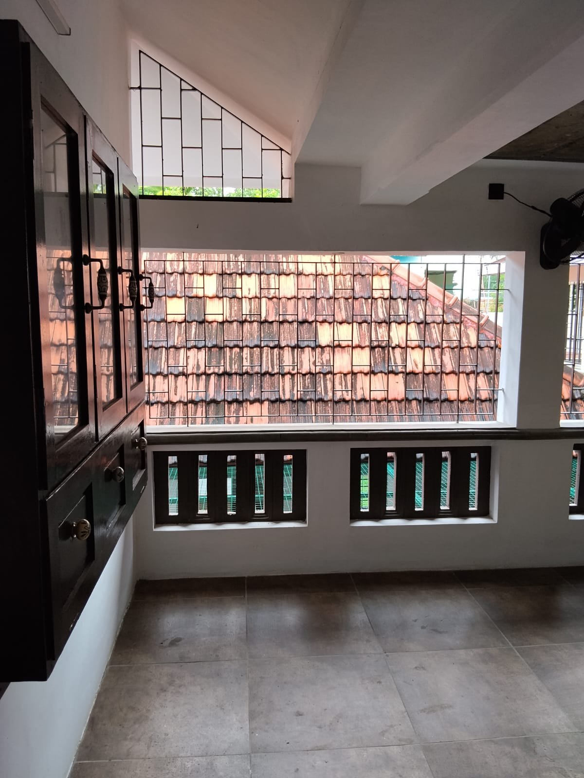 Peaceful balcony overlooking the tiled roof