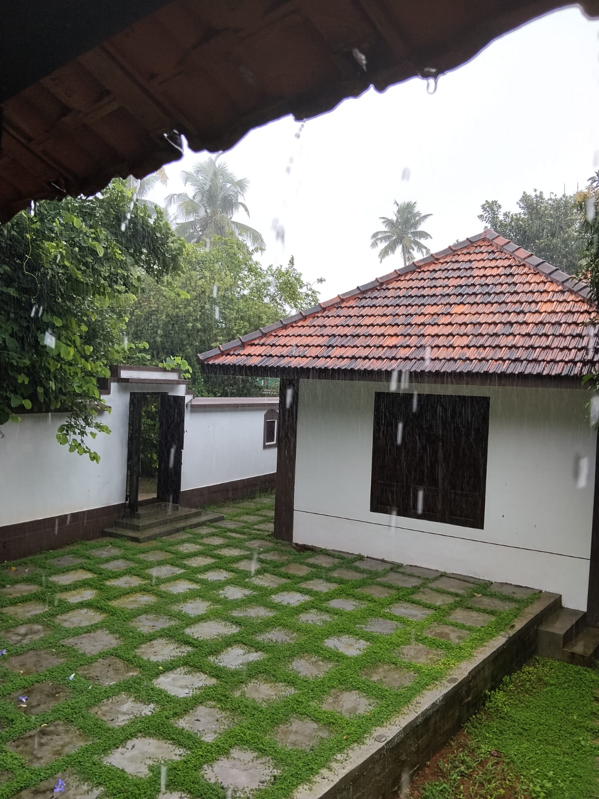 Rain over the tiled-roof courtyard