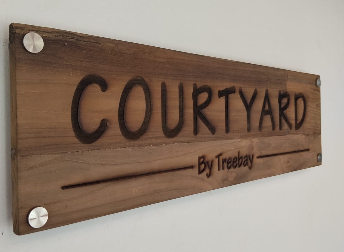Courtyard by Treebay wooden sign board